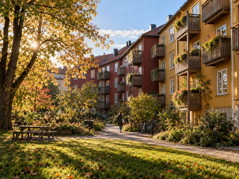 Housing cooperative blocks with timber facades and balconies in an Oslo neighbourhood, cooperative housing with blockchain in Norway