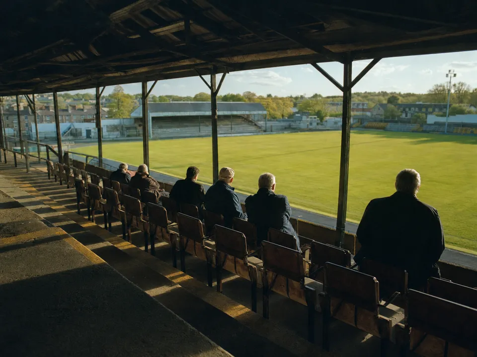 Club members seated in the old stand of the stadium, member perks through token gating