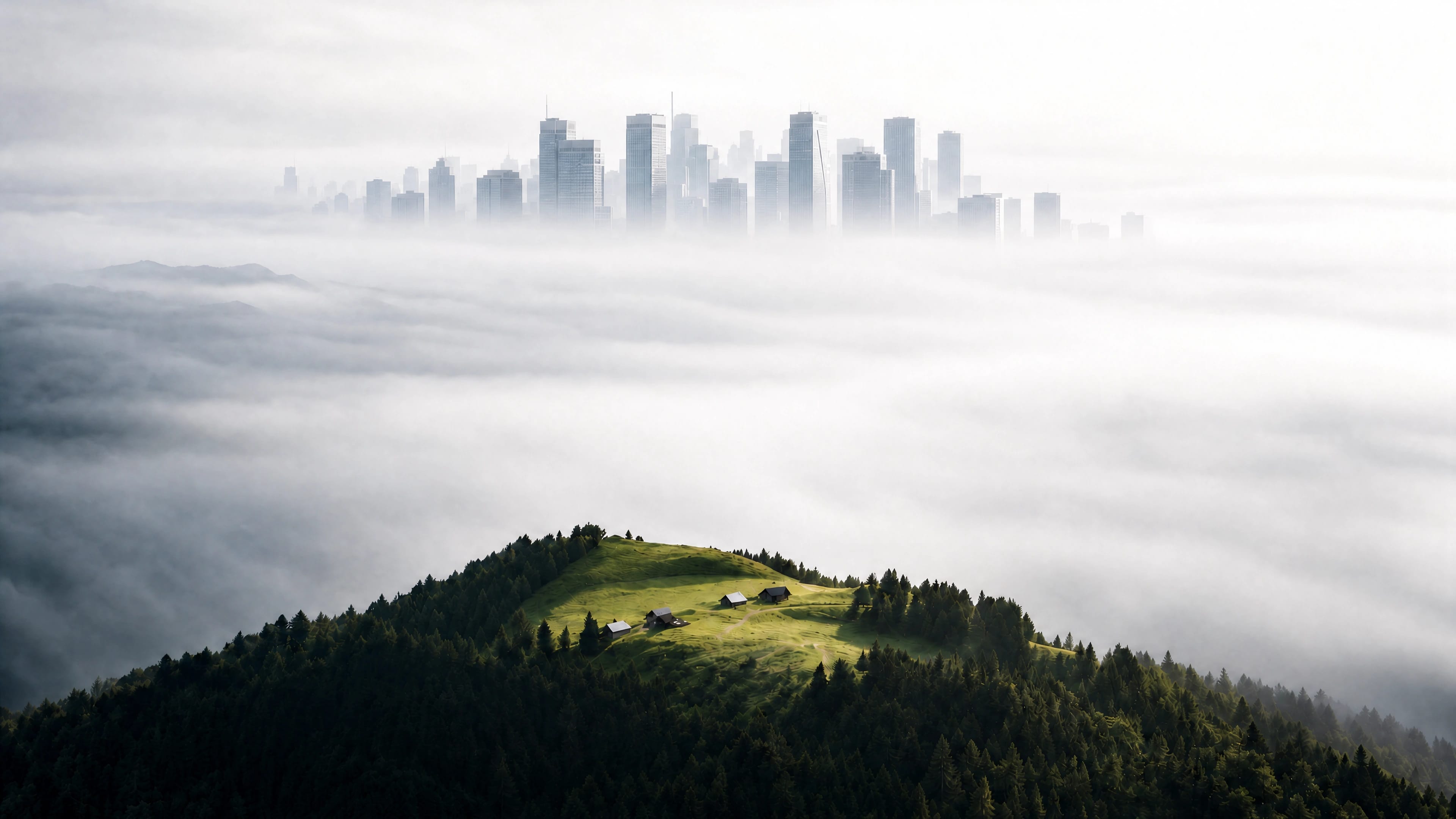 Skyscraper city in the fog above a green hillside with mountain cabins