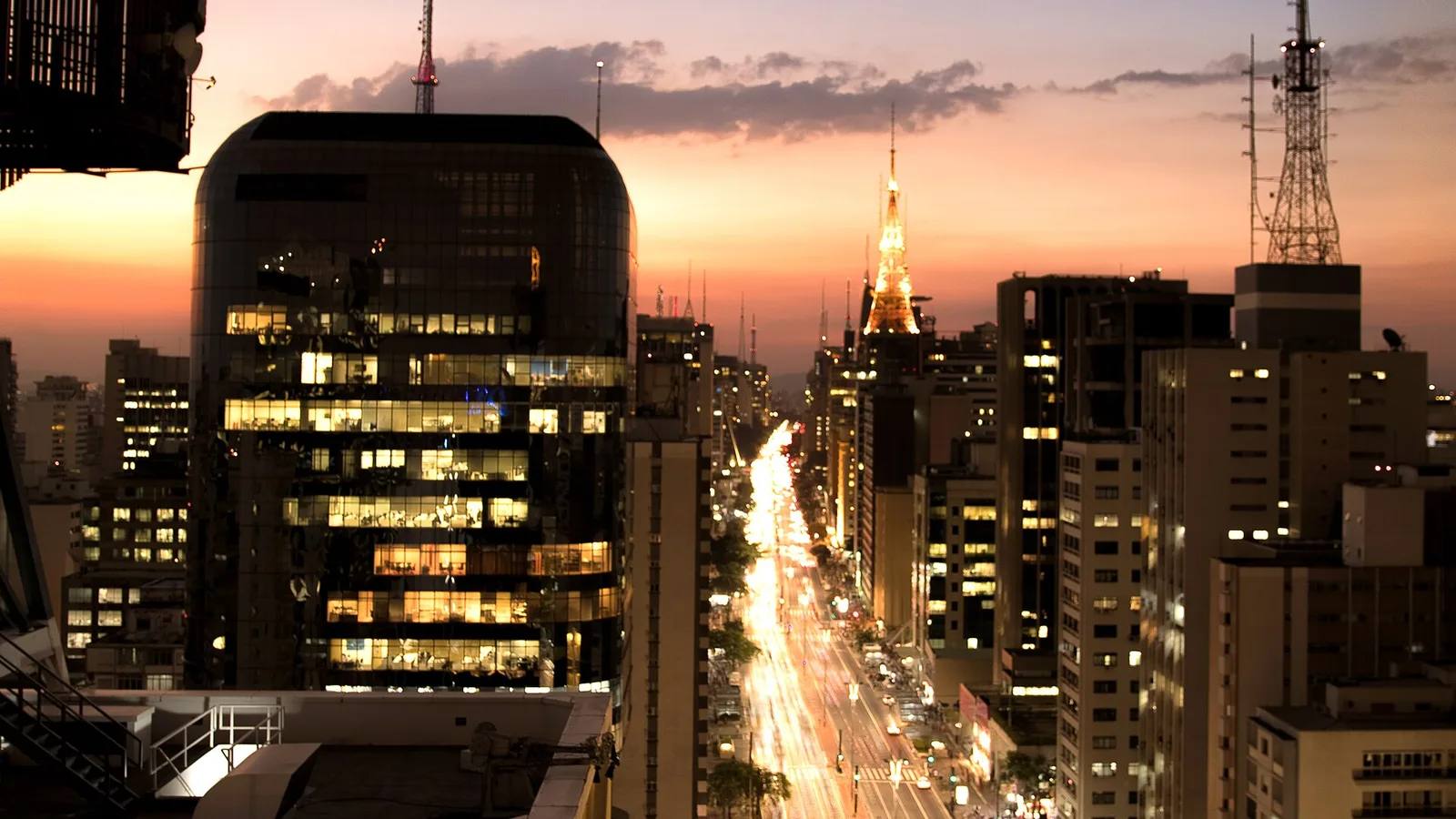 Paulista Avenue and its illuminated buildings at sunset