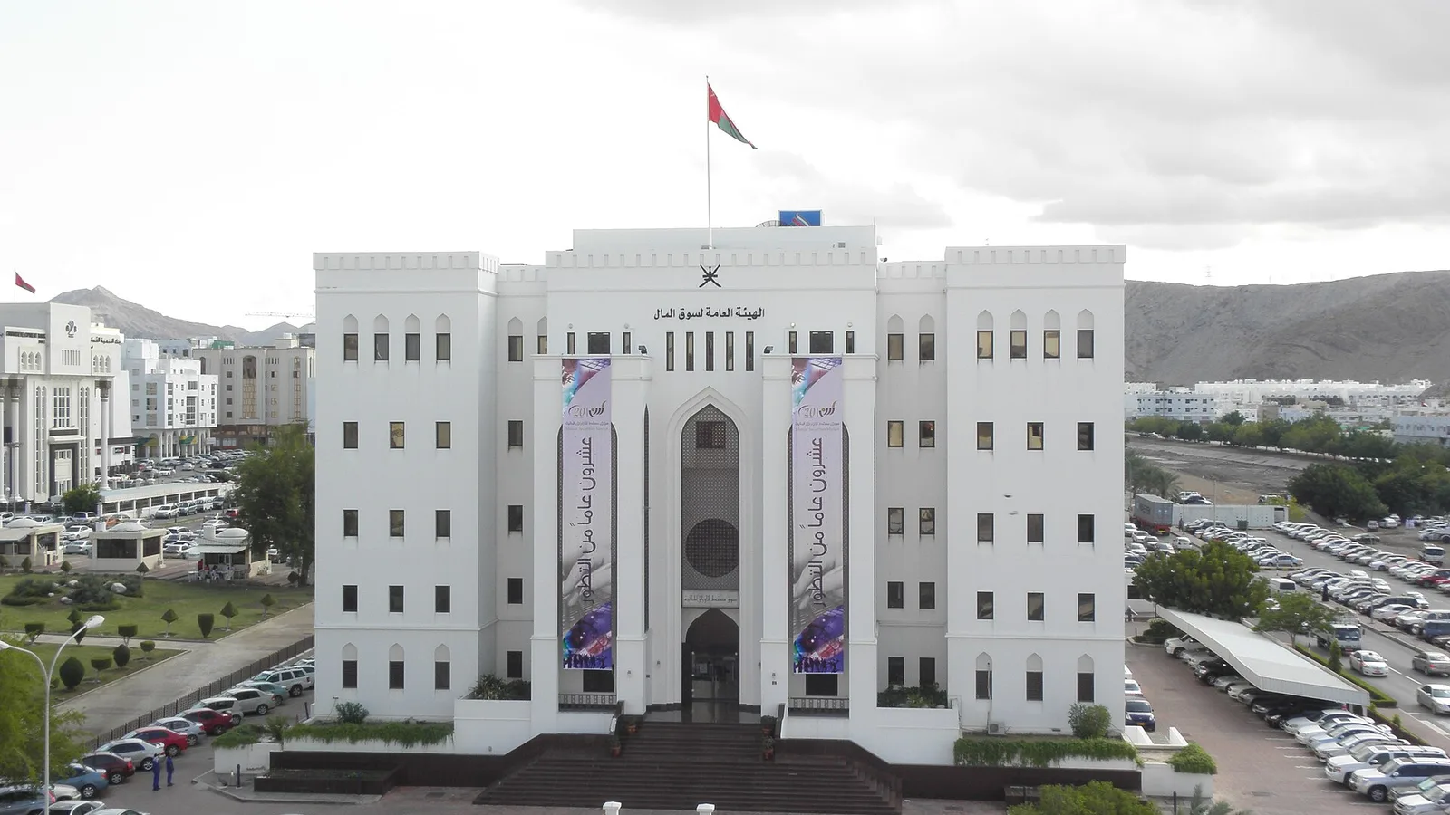 Muscat securities market building with the Omani flag