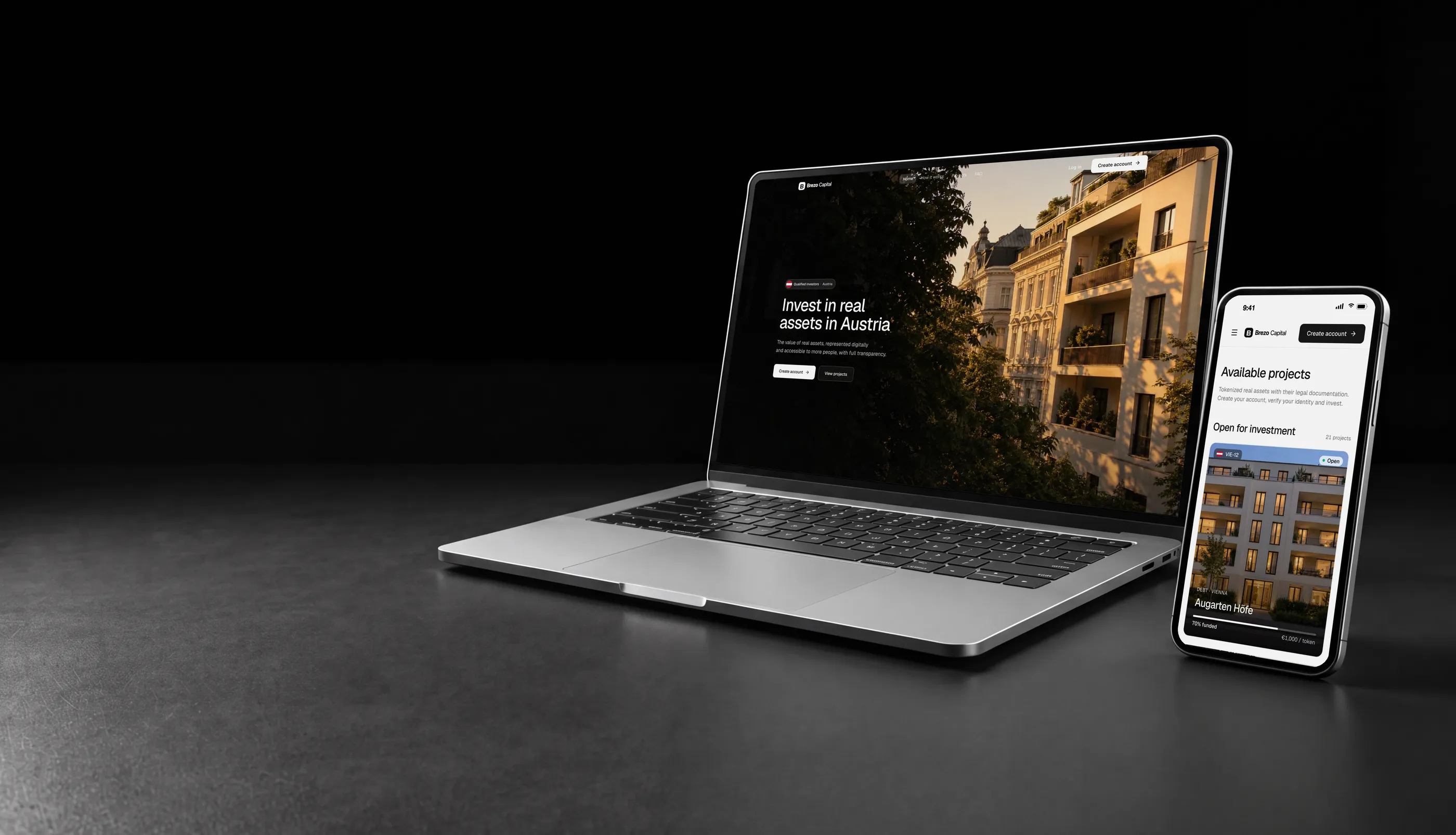 White label tokenization platform in Austria on a laptop and phone, with a residential building in Vienna
